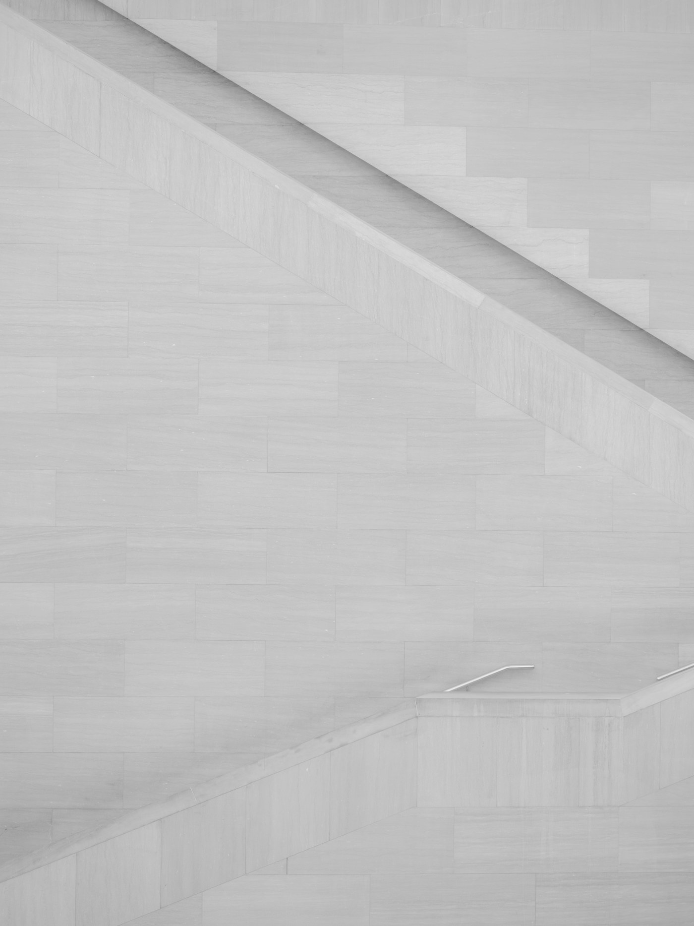 Minimal pale stone staircase geometry with diagonal lines